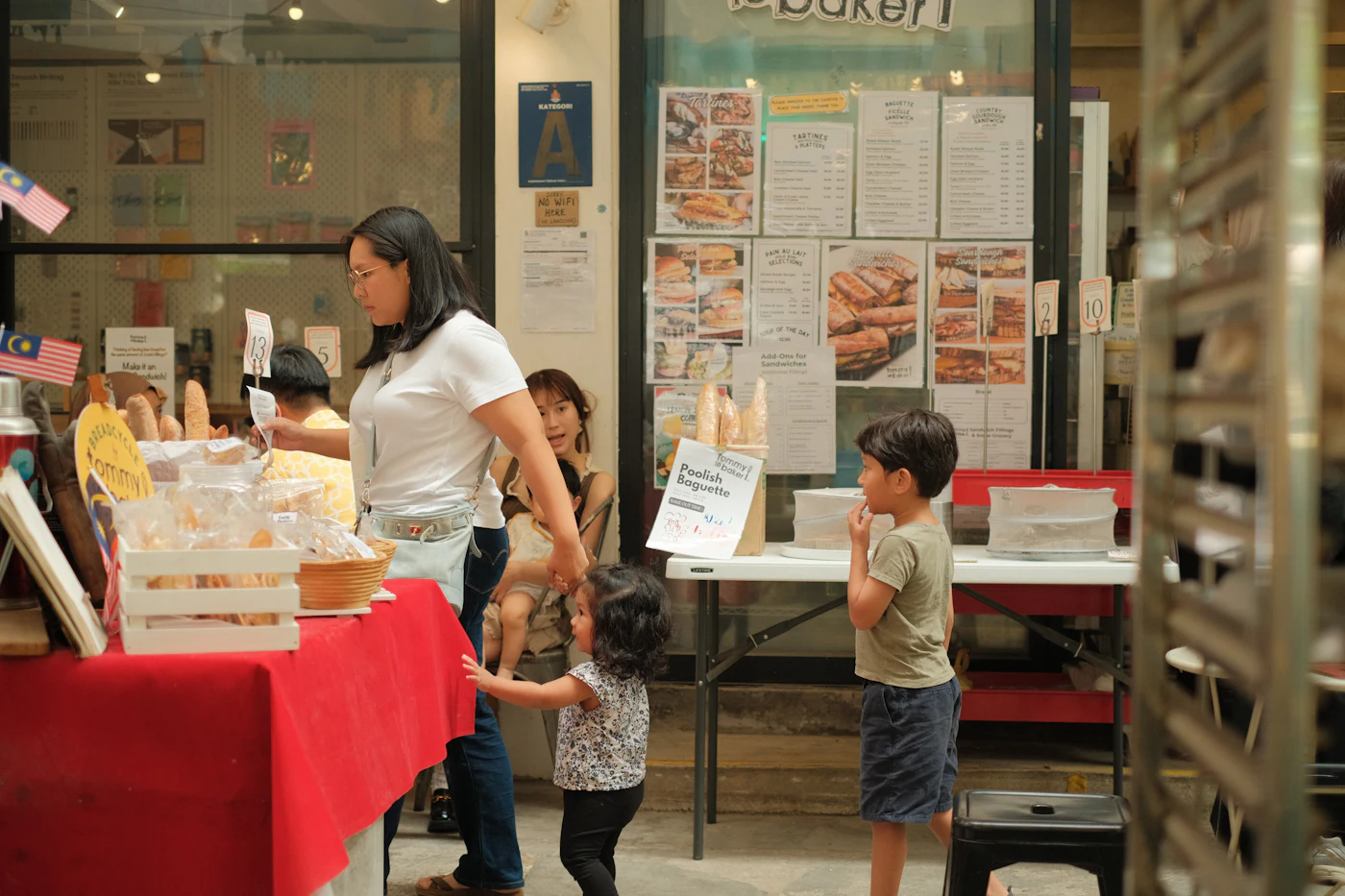 Customers browsing a neighbourhood bakery
